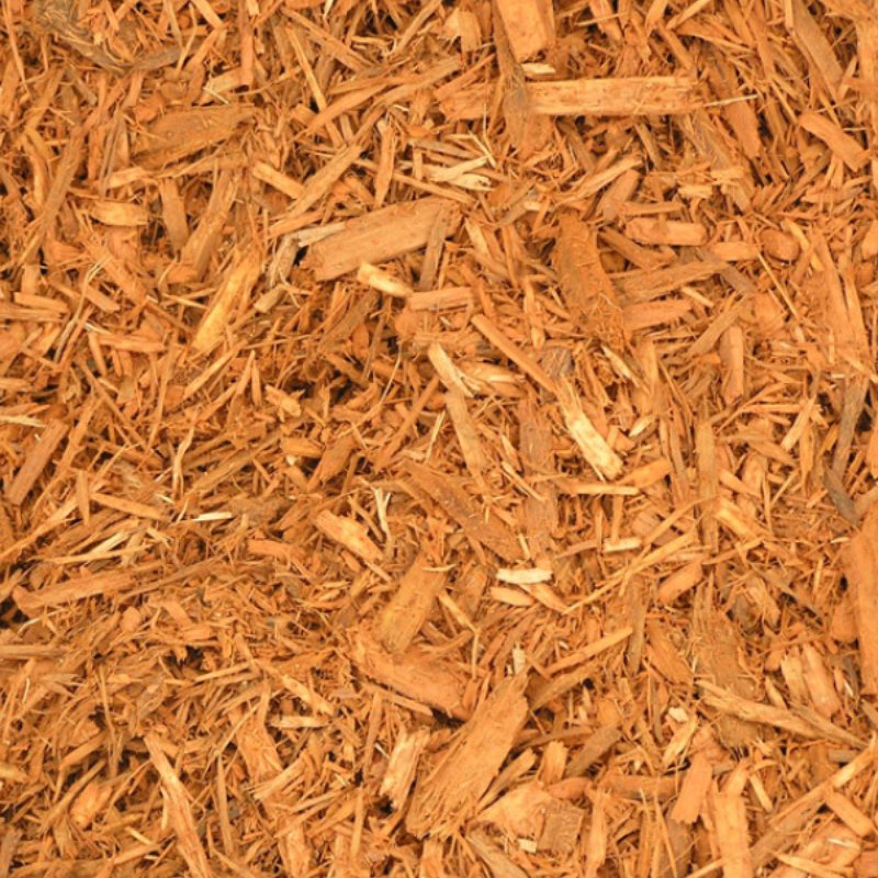 Close-up of rich orange-brown wood mulch, featuring various sized wood chips and shavings, ideal for gardening and landscaping.